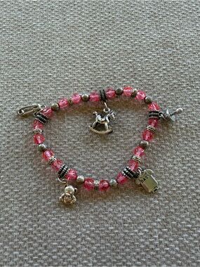 Pink Beaded Charm Bracelet with Rocking Horse and Baby Charms